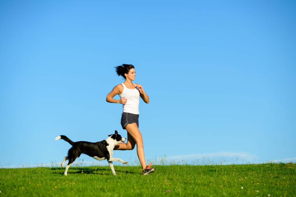 Woman exercises with dog 